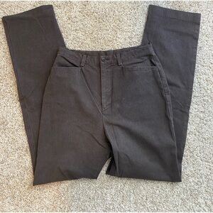 Dark brown high-waisted straight-leg pants.